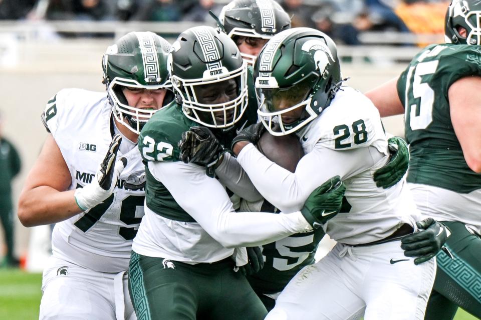 Michigan State's Bai Jobe, left, tackles Brandon Tullis during the Spring Showcase on Saturday, April 20, 2024, at Spartan Stadium in East Lansing.