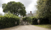 A gate closes off a side entrance of the Rooksnest estate near Lambourn, England, Tuesday, Aug. 6, 2019. The property belongs to the Sackler family, owners of Purdue Pharma based in Stamford, Conn. A complex web of companies and trusts are controlled by the family, and an examination reveals links between far-flung holdings, far removed from the opioid manufacturer’s headquarters in the U.S. (AP Photo/Frank Augstein)