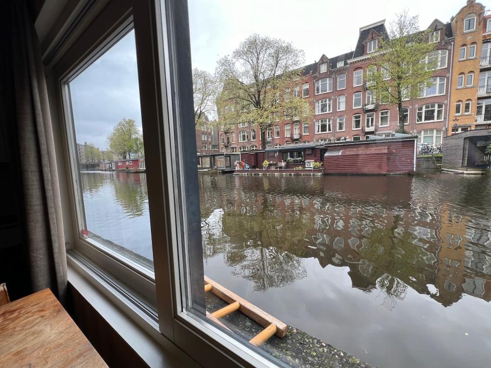 view out the window of houseboat in amsterdam