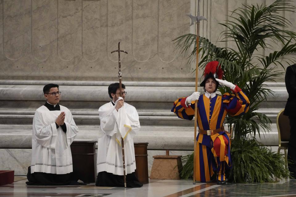 A Swiss guard gestures as Pope Francis celebrates the Holy Chrism Mass in St. Peter's Basilica, at The Vatican, Thursday, March 28, 2024. (AP Photo/Gregorio Borgia)