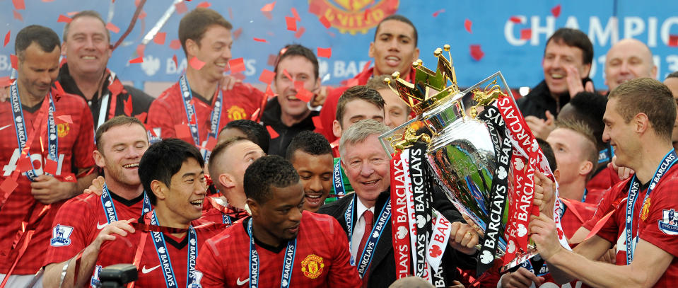 Manchester United manager Sir Alex Ferguson celebrates with the Barclays Premier League trophy after the Barclays Premier League match at Old Trafford, Manchester.