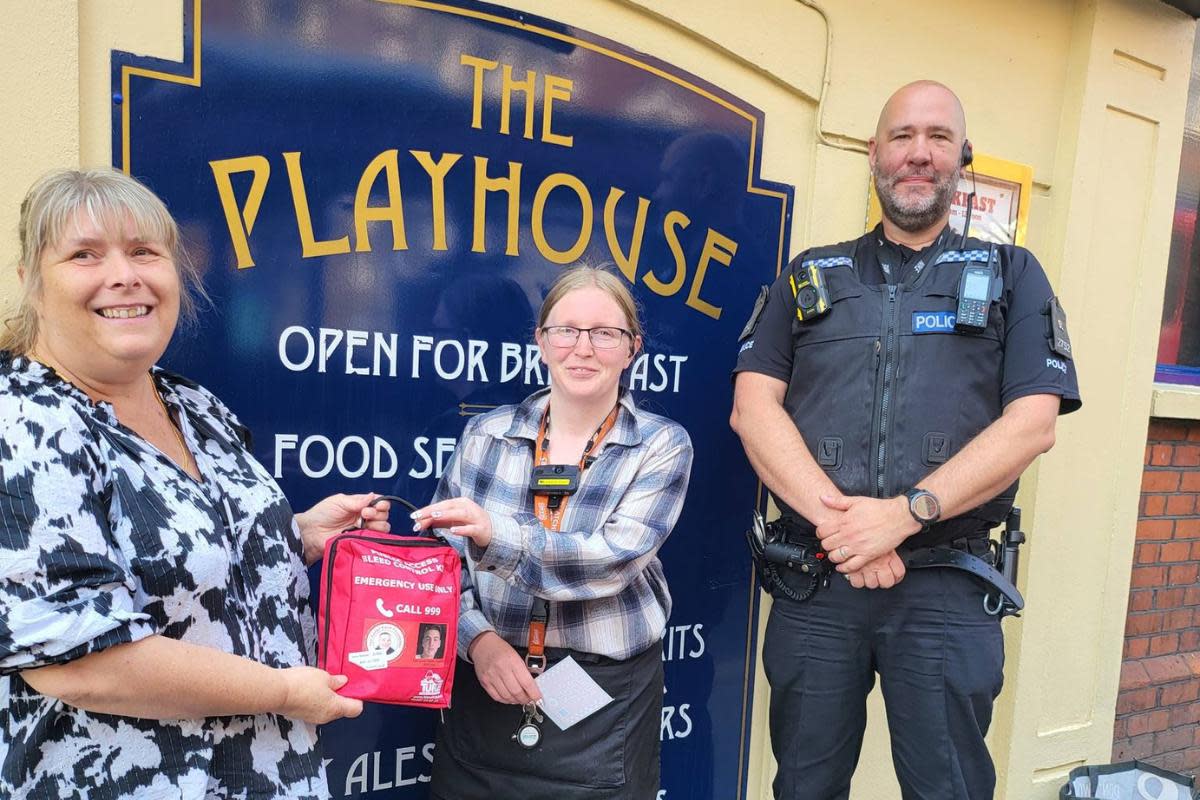 Kits - Julie Taylor donated bleed kits to a number of venues in Colchester, pictured with Gemma Potticary from The Playhouse and PC Dave Bishop <i>(Image: Essex Police)</i>