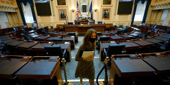 This Wednesday Feb. 10, 2021 file photo shows House speaker Del. Eileen Filler-Corn, D-Fairfax, as she exits the center isle of the empty Virginia House of Delegates chamber
