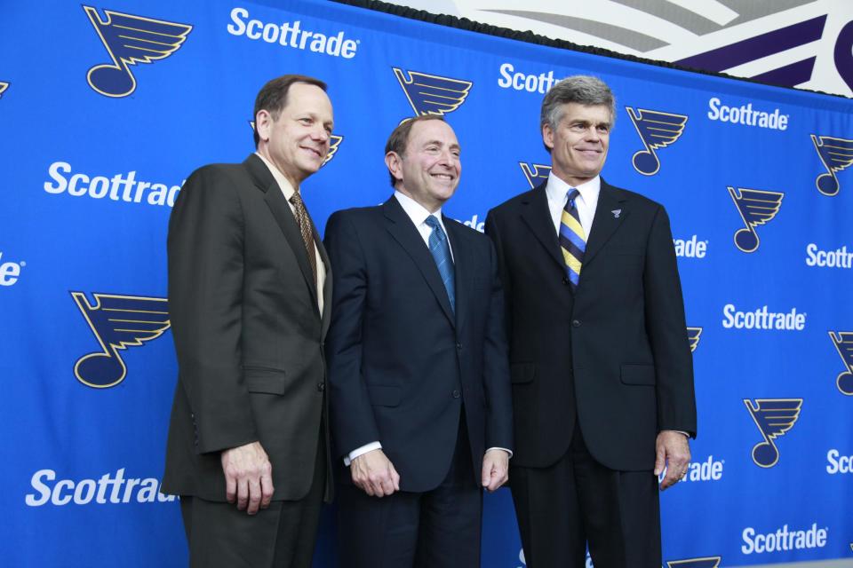 St. Louis Mayor Francis Slay, left, NHL Commissioner Gary Bettman, center, and Tom Stillman pose for photos after a news conference introducing Stillman as the new majority owner of the St. Louis Blues hockey club, Thursday, May 10, 2012, in St. Louis. The Stillman group will become the eighth owner of the Blues since the franchise started in 1966. (AP Photo/Jeff Roberson)