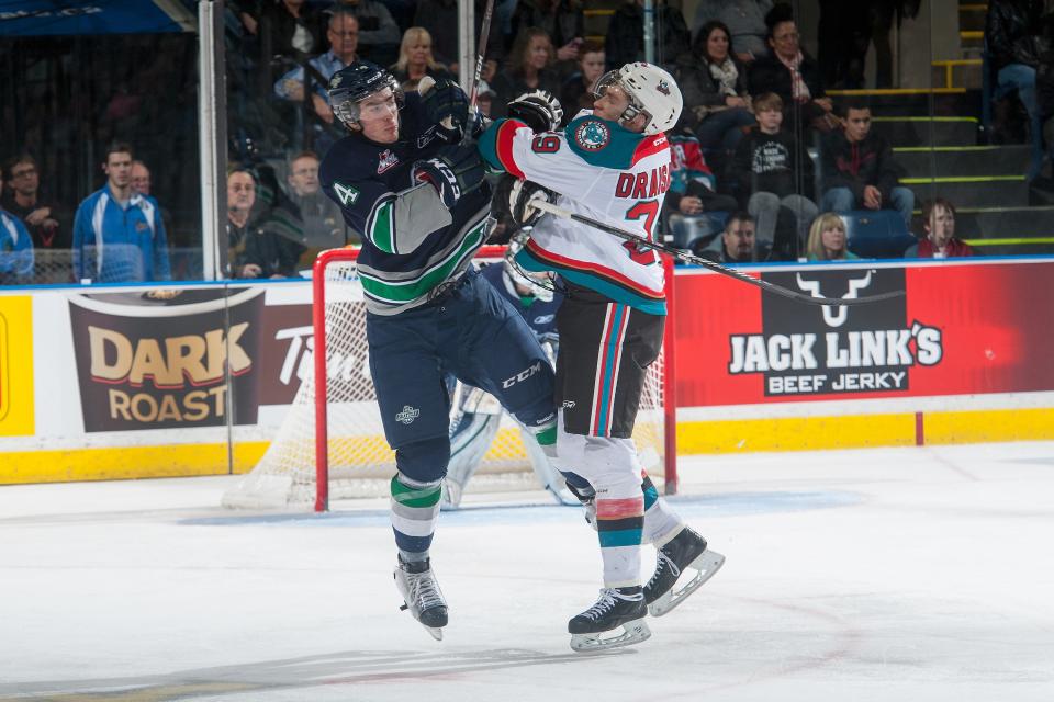 KELOWNA, CANADA - JANUARY 16: Leon Draisaitl #29 of Kelowna Rockets checks Turner Ottenbreit #4 of Seattle Thunderbirds during third period on January 16, 2015 at Prospera Place in Kelowna, British Columbia, Canada. (Photo by Marissa Baecker/Getty Images)