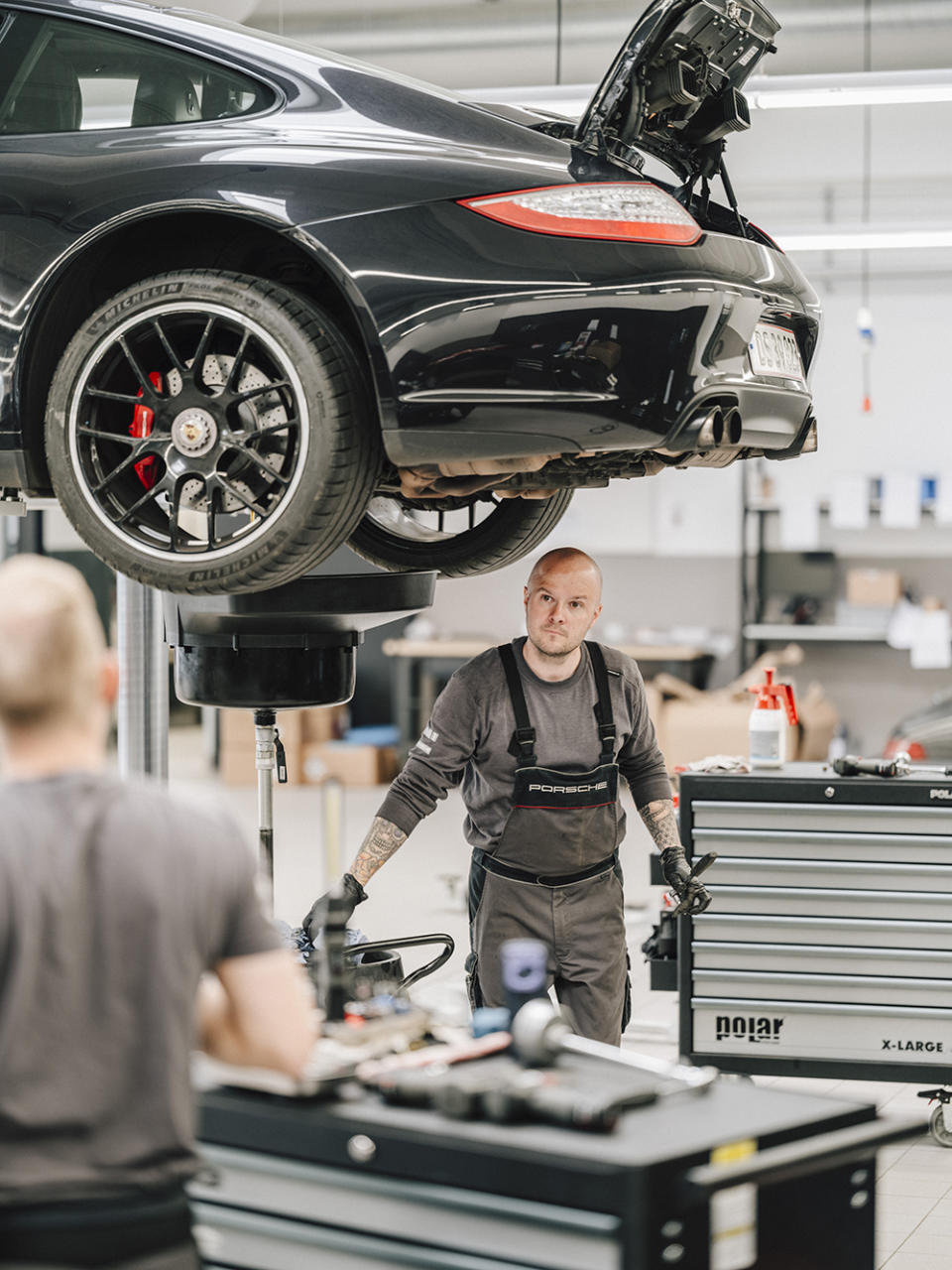 A mechanic at the Porsche workshop