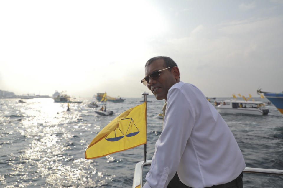 Maldives’ former president Mohamed Nasheed, heads on a launch to the capital to meet the public after his arrival in Maldives, Thursday, Nov.1, 2018. Nasheed, the first democratically elected president of the Maldives returned home Thursday after more than two years in exile to escape a long prison term. (AP Photo/Mohamed Sharuhaan)