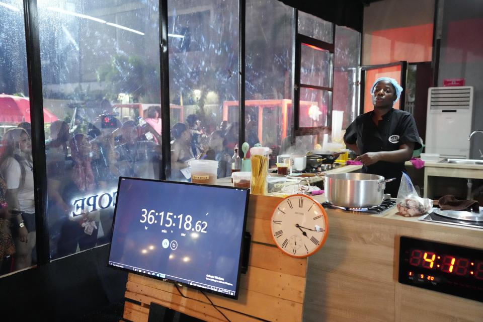 Chef, Hilda Baci, cooked to establish a new Guinness world record , for the "longest cooking marathon". The 97-hour cook-a-thon in Lagos, Nigeria. Saturday, May. 13, 2023. A Nigerian chef on Monday continued her quest to set a new global record for the longest hours of nonstop cooking after surpassing the current record of 87 hours and 45 minutes. By 15:00 GMT on Monday, Hilda Baci had cooked for more than 97 hours, becoming a national sensation and to the cheering of many in Nigeria's commercial hub of Lagos where her kitchen is set. (AP Photo/Sunday Alamba)