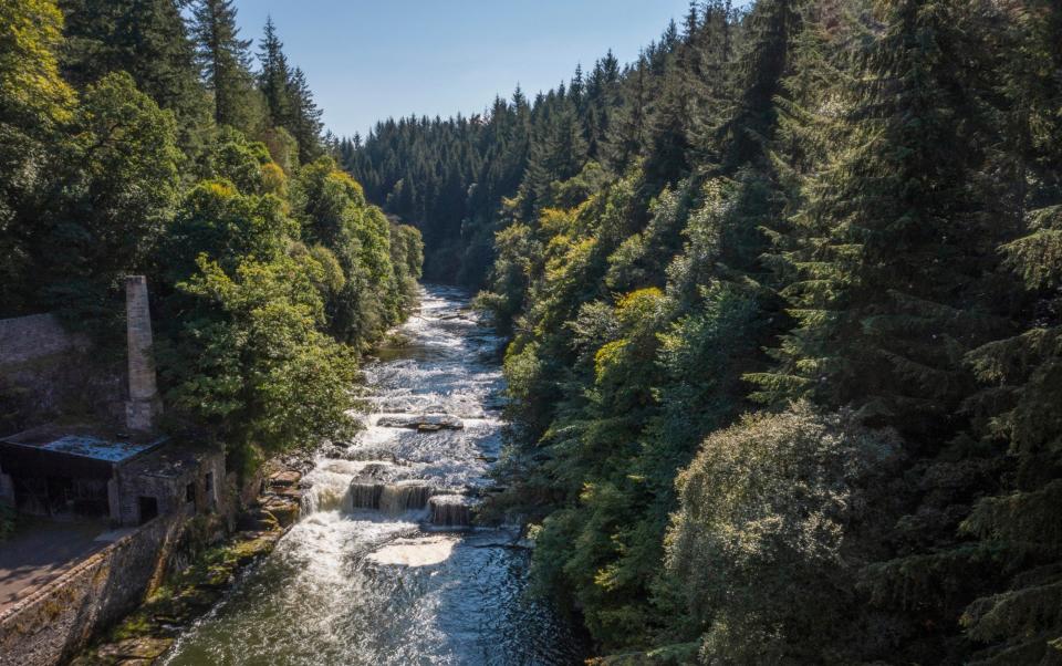 The Falls of Clyde, alongside New Lanark