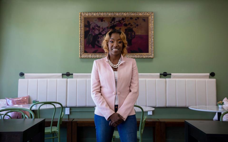 Charity Dean, the head of the Metro Detroit Black Business Alliance, sits inside Rosa in Detroit on Aug. 10, 2022. In memory of her great grandmother, Dean recently opened Rosa, a coffee shop in the Grandmont Rosedale neighborhood. Dean is the winner of the 2022 Dave Bing Young Leader Award, part of the Shining Light Awards.