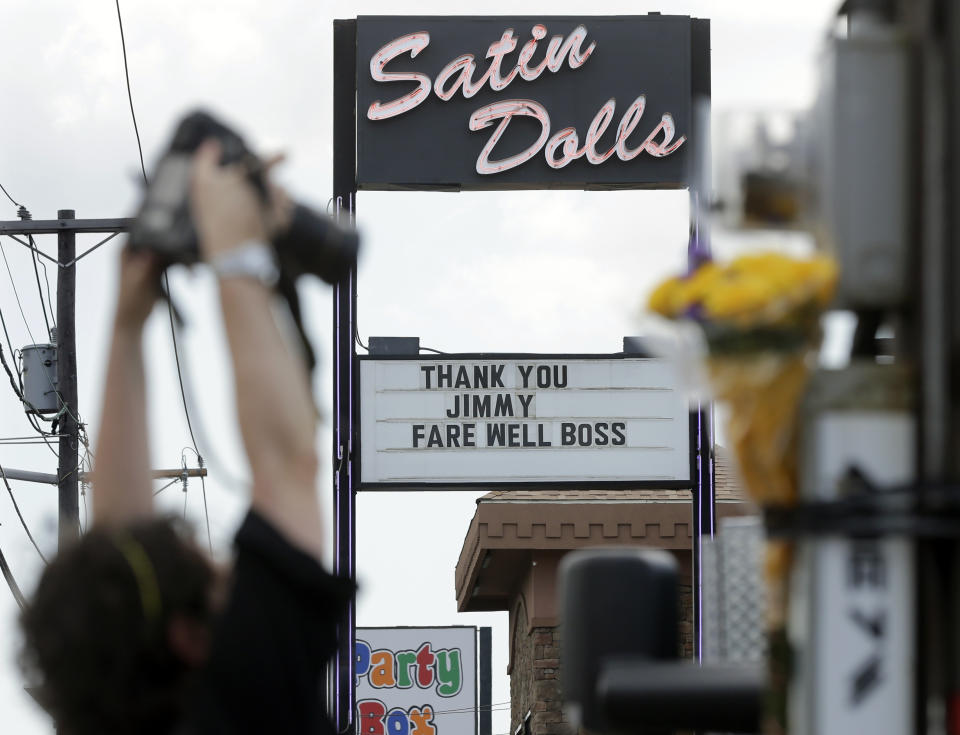 FILE - This June 20, 2013 file photo shows the exterior of Satin Dolls, in Lodi, N.J., the location for the Bada Bing Club on the HBO series "The Sopranos." The marquee offers a tribute to the late actor James Gandolfini, who portrayed mob boss Tony Soprano. The site may be of interest to Super Bowl visitors who are also Sopranos fans. (AP Photo/Mel Evans, File)
