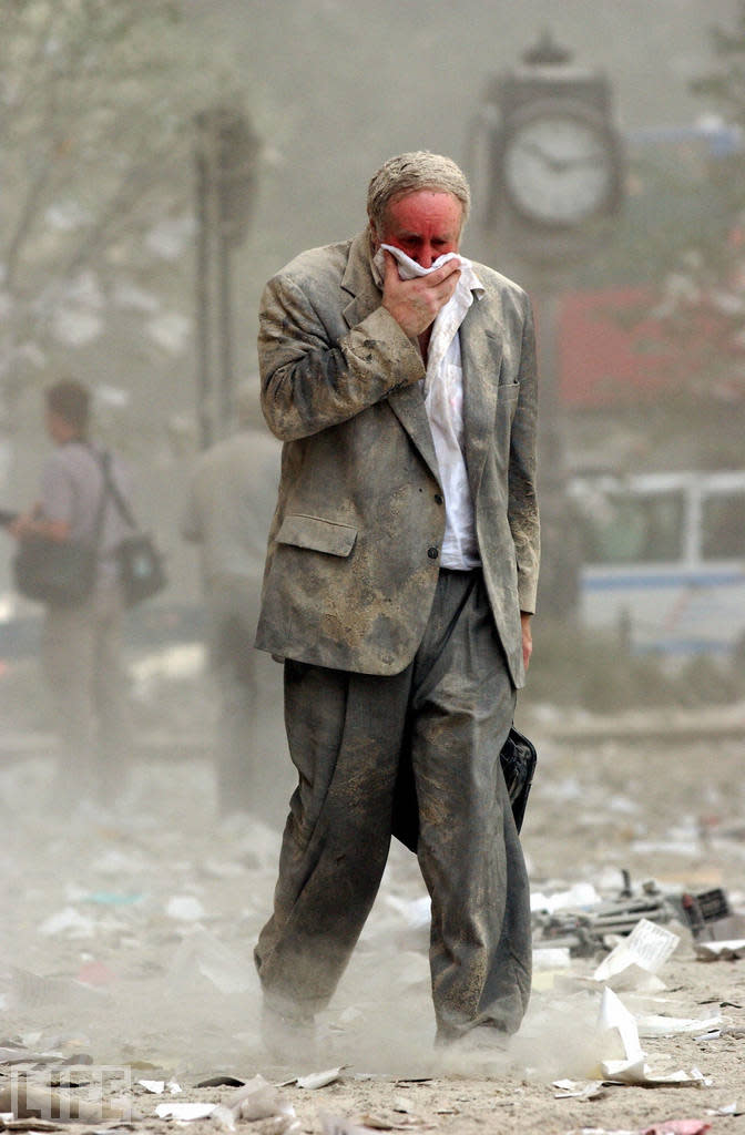 This image (another by Stan Honda) is an exemplar of a strange, wrenching sight witnessed by innumerable people in New York on the morning of September 11: A survivor, layered in eerie, white dust, trudging away from the cataclysm. The man, Edward Fine, was an owner of an investment and public relations firm; he was on the 78th floor of 1 World Trade Center when it was hit. <br><br>(STAN HONDA/AFP/Getty Images)<br><br>For the full photo collection, go to <a href="http://www.life.com/gallery/59971/911-the-25-most-powerful-photos#index/0" rel="nofollow noopener" target="_blank" data-ylk="slk:LIFE.com;elm:context_link;itc:0;sec:content-canvas" class="link ">LIFE.com</a>