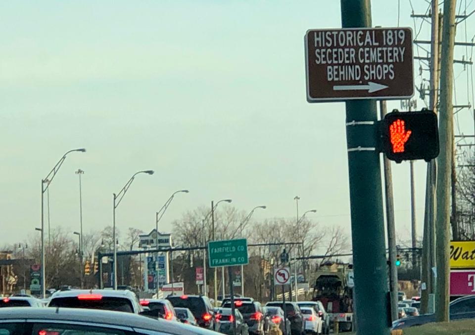 The only indication of the nearby historic Seceder Cemetery in Reynoldsburg is this small sign on busy Route 256.