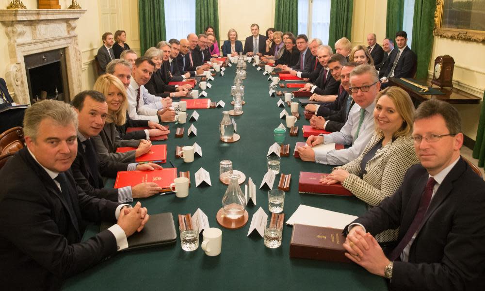 Theresa May poses with her reshuffled cabinet