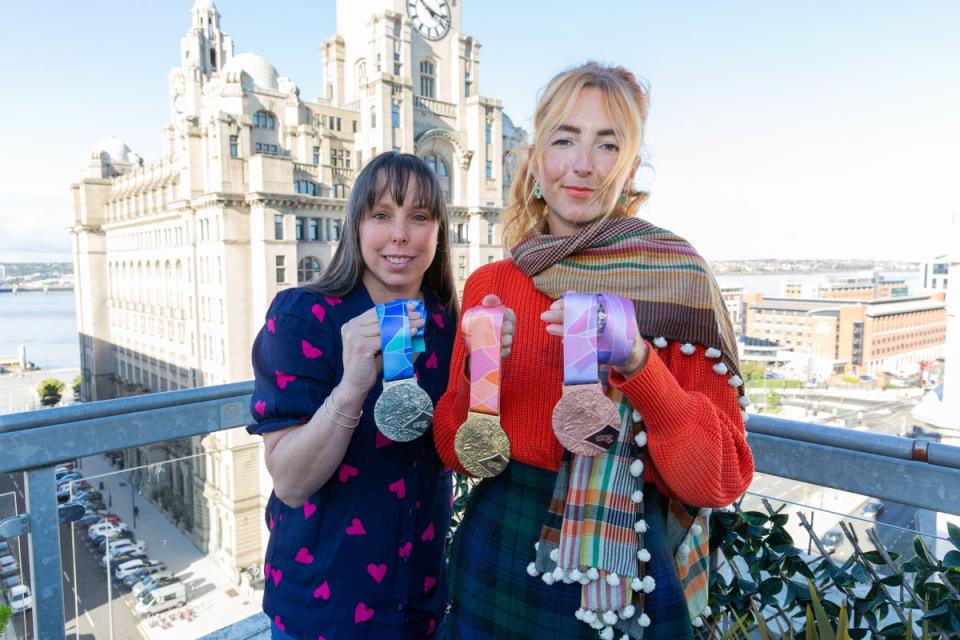 Three-time world champion Beth Tweddle, left, and designer Amy Flynn, right, with the new World Gymnastics Championships medals (Sportsbeat)