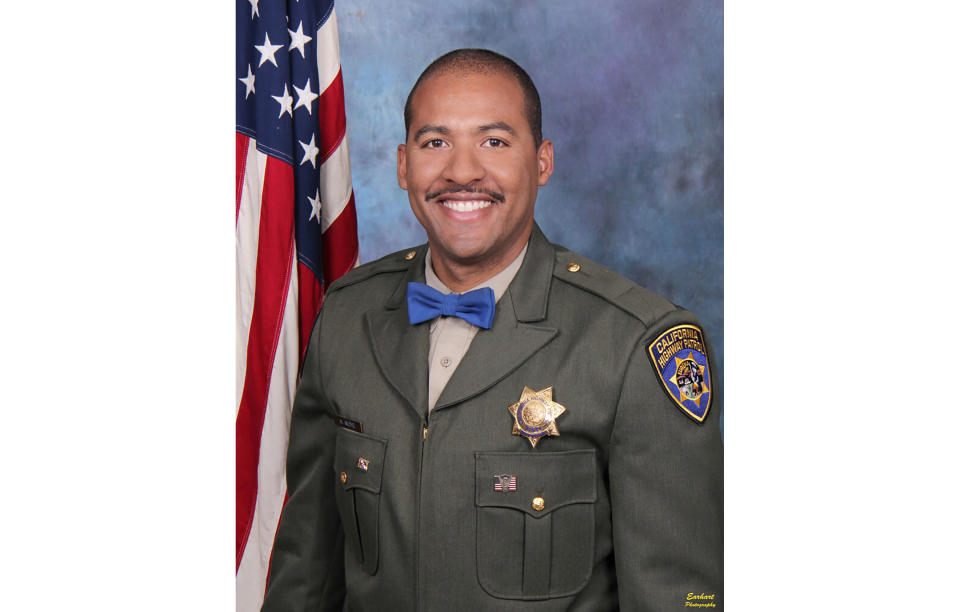 In this undated photo release by the California Highway Patrol, Officer Andre Moye Jr. A driver stopped by police pulled out a rifle and opened fire, killing Moye and wounding a few others during a shootout on a freeway overpass that left the gunman dead and sent terrified motorists running for cover. (David Earhart/Earhart Photography/California Highway Patrol via AP)