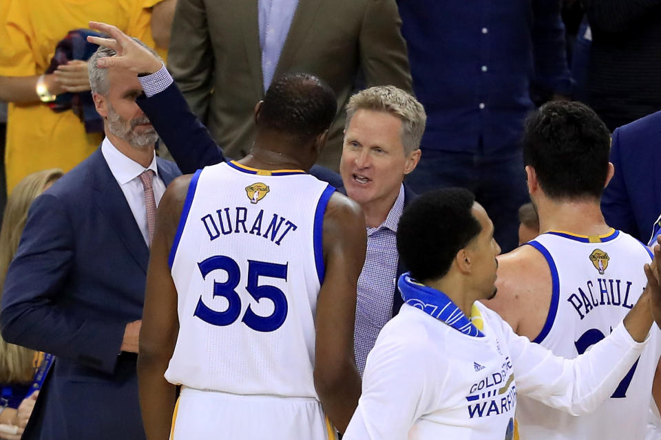 Steve Kerr speaks with Kevin Durant on the bench during Game 2 of the 2017 NBA Finals. (Ronald Martinez/Getty Images)