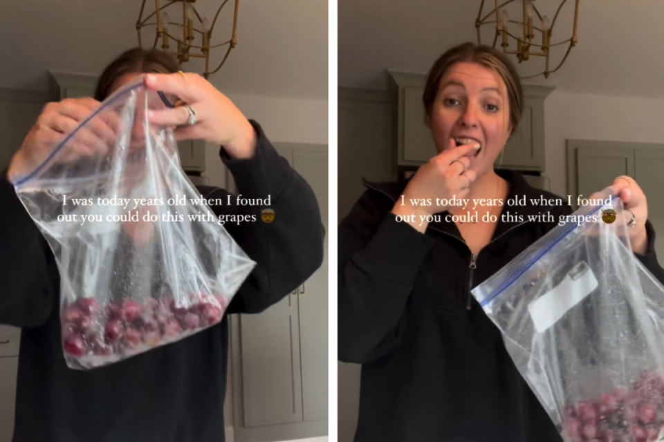 A mum pulling a grape out of a snaplock bag and eating it