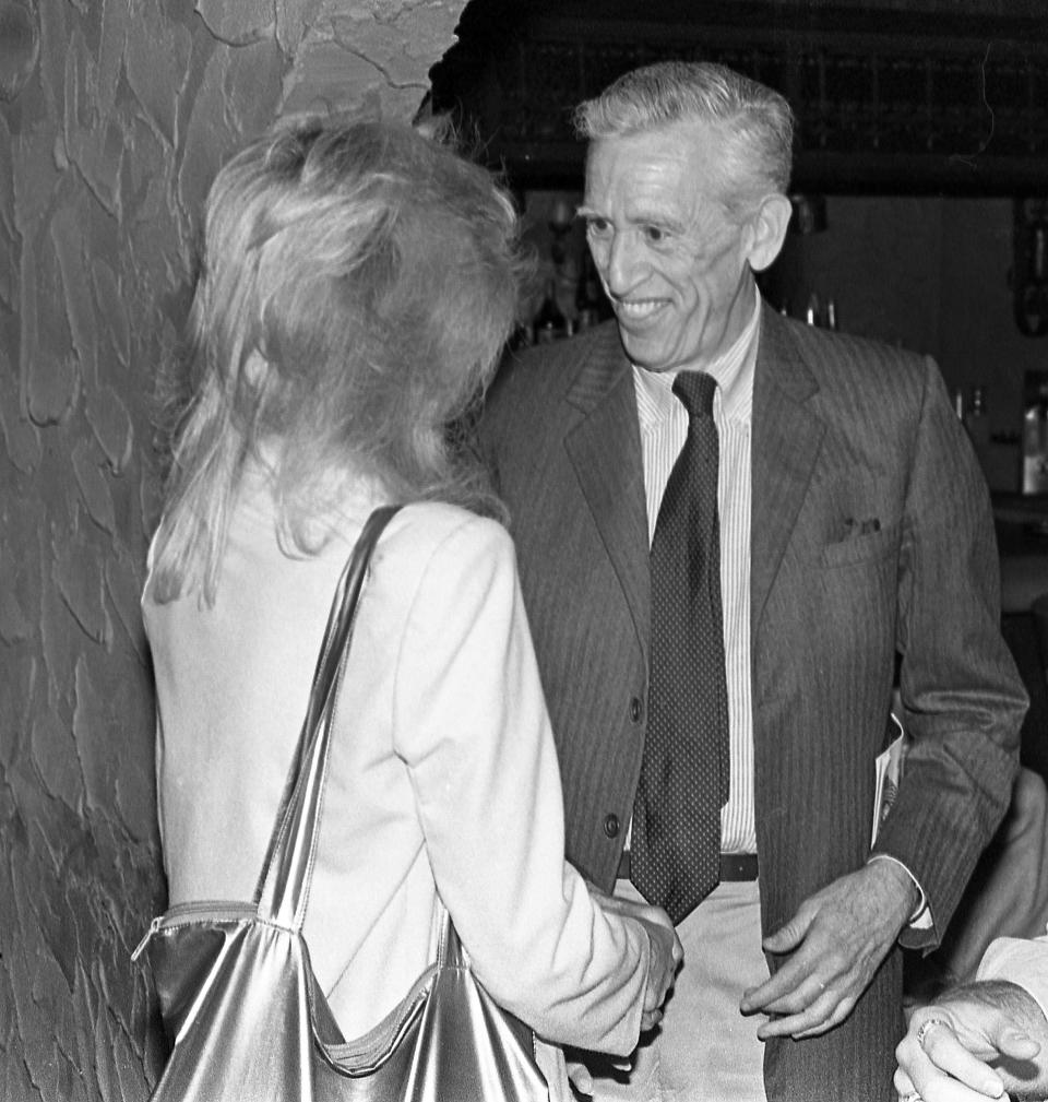 FILE - In this May 11, 1982, file photo, J.D. Salinger, right, author of Catcher in the Rye, meets up with actress Elaine Joyce to see her performance in "6 Rms Riv Vu," at the Alhambra Dinner Theater, in Jacksonville, Fla. With Salinger’s centennial coming in 2019, the big news so far is that his publisher is planning to celebrate it. Little, Brown and Company announced Tuesday, Sept. 4, 2018, that new editions of “The Catcher in the Rye” and his three other books would be released in November. (Gene Sweeney Jr./The Florida Times-Union via AP)