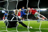 Manchester United's Wayne Rooney and Leicester's Robert Huth in action as Kasper Schmeichel looks on Action Images via Reuters / John Sibley