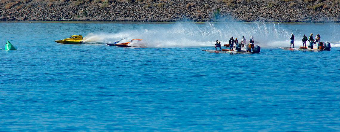 Kurt Myers, far left, in the E-1 racing boats leads the field past Water Follies rescue sleds at the start of the championship race for the E-350 class Sunday at the Columbia Cup. Myers won the three lap final race.