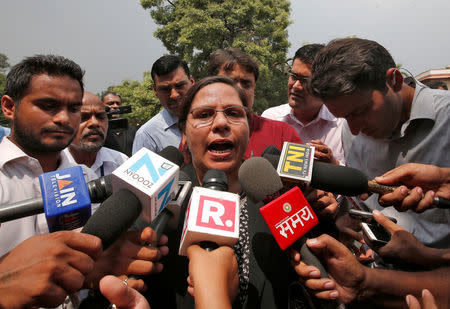 Farha Faiz, a lawyer, speaks with the media after a verdict for the controversial Muslim quick divorce law outside the Supreme Court in New Delhi, India August 22, 2017. REUTERS/Adnan Abidi