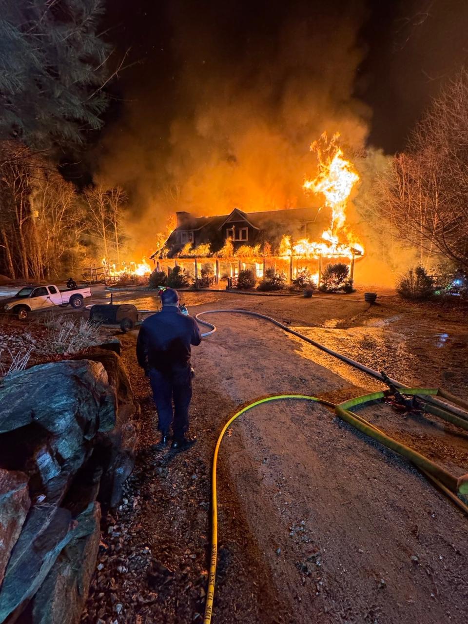 A building at Wayfarer Camp in Flat Rock is engulfed in flames on March 1.