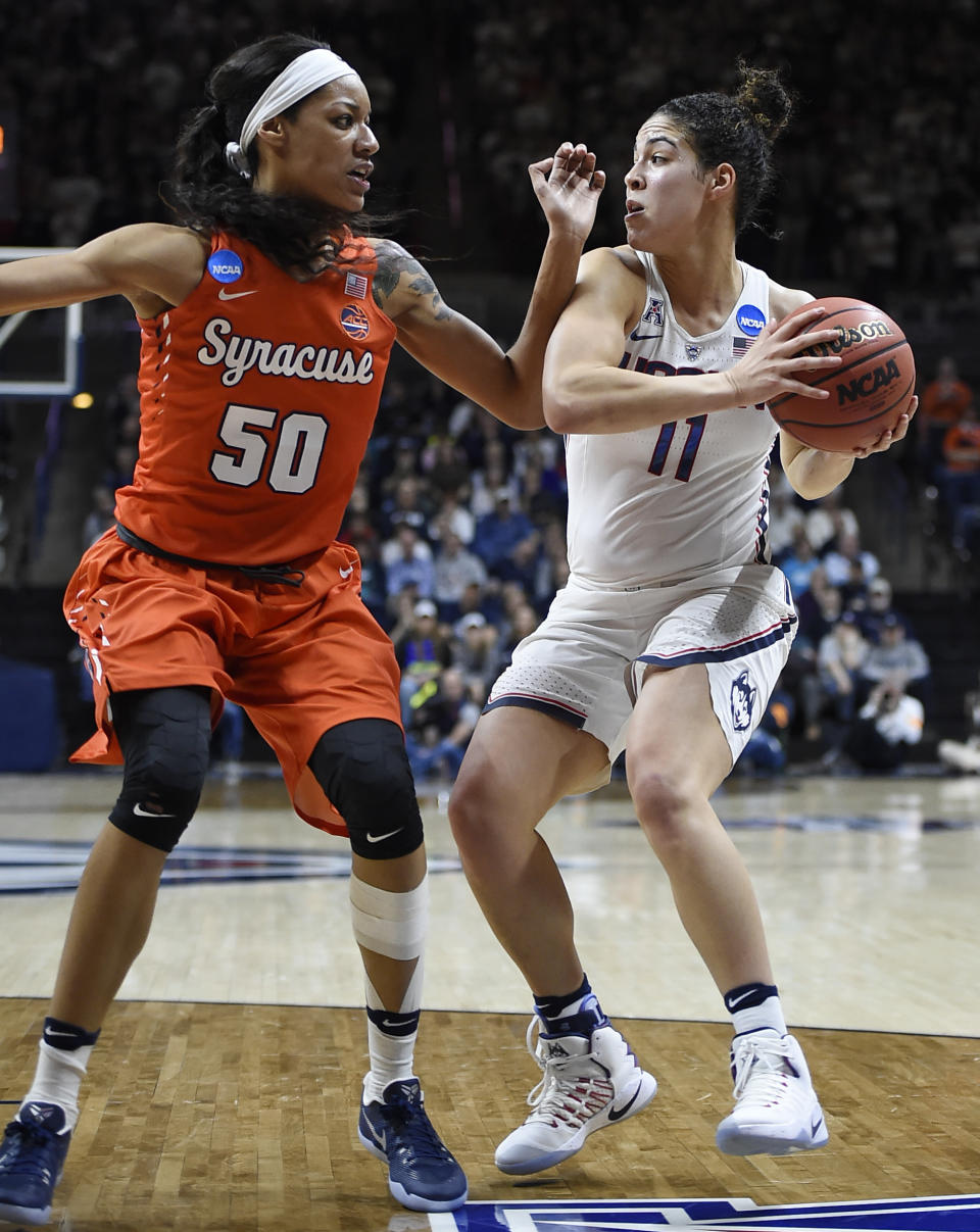 Connecticut's Kia Nurse keeps the ball from Syracuse's Briana Day, left, during the second half of a second-round game in the NCAA women's college basketball tournament, Monday, March 20, 2017, in Storrs, Conn. (AP Photo/Jessica Hill)