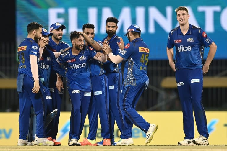 Akash Madhwal (4L) celebrates with teammates after the dismissal of Lucknow Super Giants' Mohsin Khan