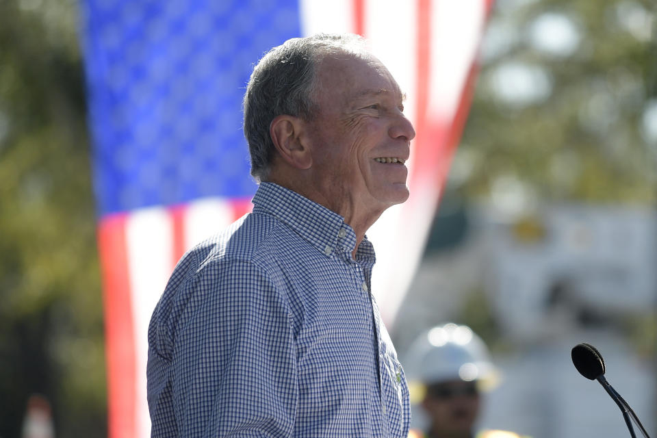 In this Feb. 8, 2019, photo, former New York City Mayor Michael Bloomberg speaks during a visit to an Orlando Utilities Commission facility in Orlando, Fla. Bloomberg measures his progress on climate change in metric tons. His political party, it seems, prefers big ideas. Many Democratic presidential contenders embraced the “Green New Deal” immediately after it was released last week.(AP Photo/Phelan M. Ebenhack)