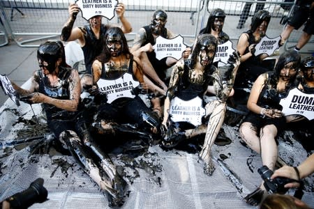 Activists from PETA stage a demonstration outside a venue during London Fashion Week in London