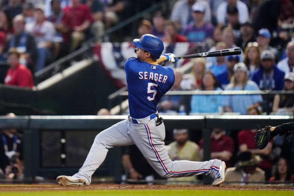 PHOENIX, AZ - OCTOBER 30:  Corey Seager #5 of the Texas Rangers hits a two-run home run in the third inning during Game 3 of the 2023 World Series between the Texas Rangers and the Arizona Diamondbacks at Chase Field on Monday, October 30, 2023 in Phoenix, Arizona. (Photo by Daniel Shirey/MLB Photos via Getty Images)