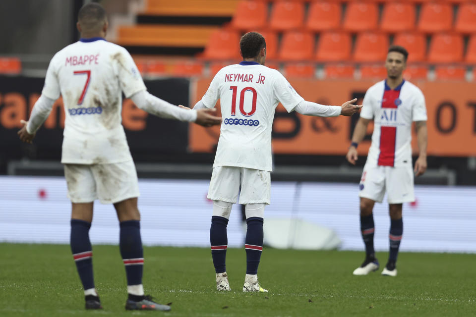 PSG's Neymar, center, and Kylian Mbappe react after being defeated by FC Lorient during the French League One soccer match between FC Lorient and Paris Saint-Germain at the Moustoir stadium in Lorient, western France, Sunday, Jan. 31, 2021. (AP Photo/David Vincent)