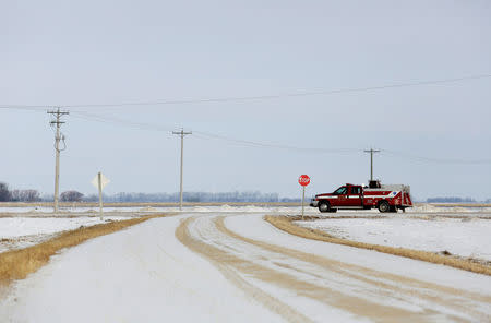 A fire department rescue truck is seen on Highway 75, a route sometimes travelled by migrants walking from the United States to enter Canada, in Emerson, Manitoba, Canada February 25, 2017. REUTERS/Lyle Stafford
