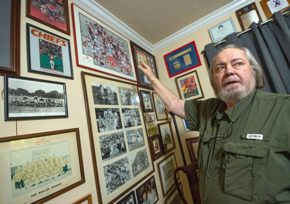 Longtime Kansas City Chiefs fan Michael Flannes discusses his collection of Chiefs memorabilia in his Jackson, Miss., home on Thursday, Feb. 1. His father was one of a group of 25 people who worked to get the American Football League started. The Dallas Texans, now the Chiefs, were a chartered member of the AFL. The Chiefs now play in the National Football League and are in the Super Bowl on Sunday.