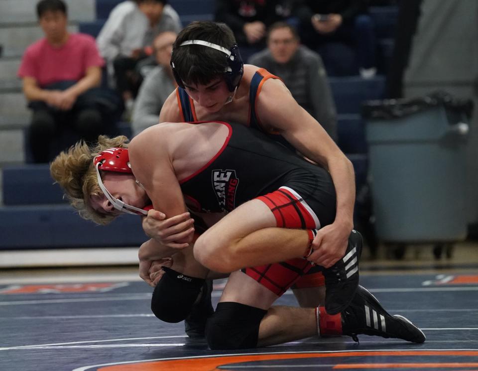 Fox Lane's Charlie Webb wrestles Horace Greeley's Corey Fitzsimmons in the 126-pound match in the quarter finals of the Section 1 Dual Meet Tournament at Horace Greeley High School in Chappaqua on Wednesday, December 14, 2022.