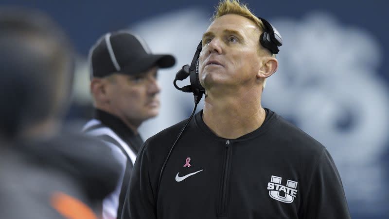 Utah State coach Blake Anderson looks up at the scoreboard during the second half of the team’s NCAA college football game against Fresno State on Friday, Oct. 13, 2023, in Logan, Utah. 