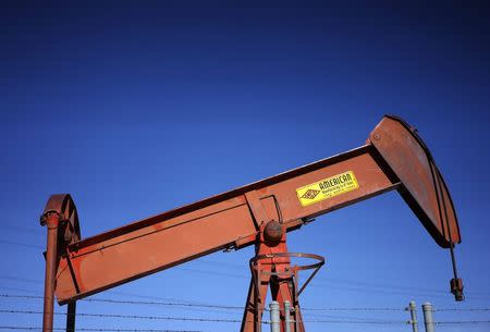 An oil well pump jack is seen at an oil field supply yard near Denver, Colorado, in this file photo taken February 2, 2015. REUTERS/Rick Wilking/Files