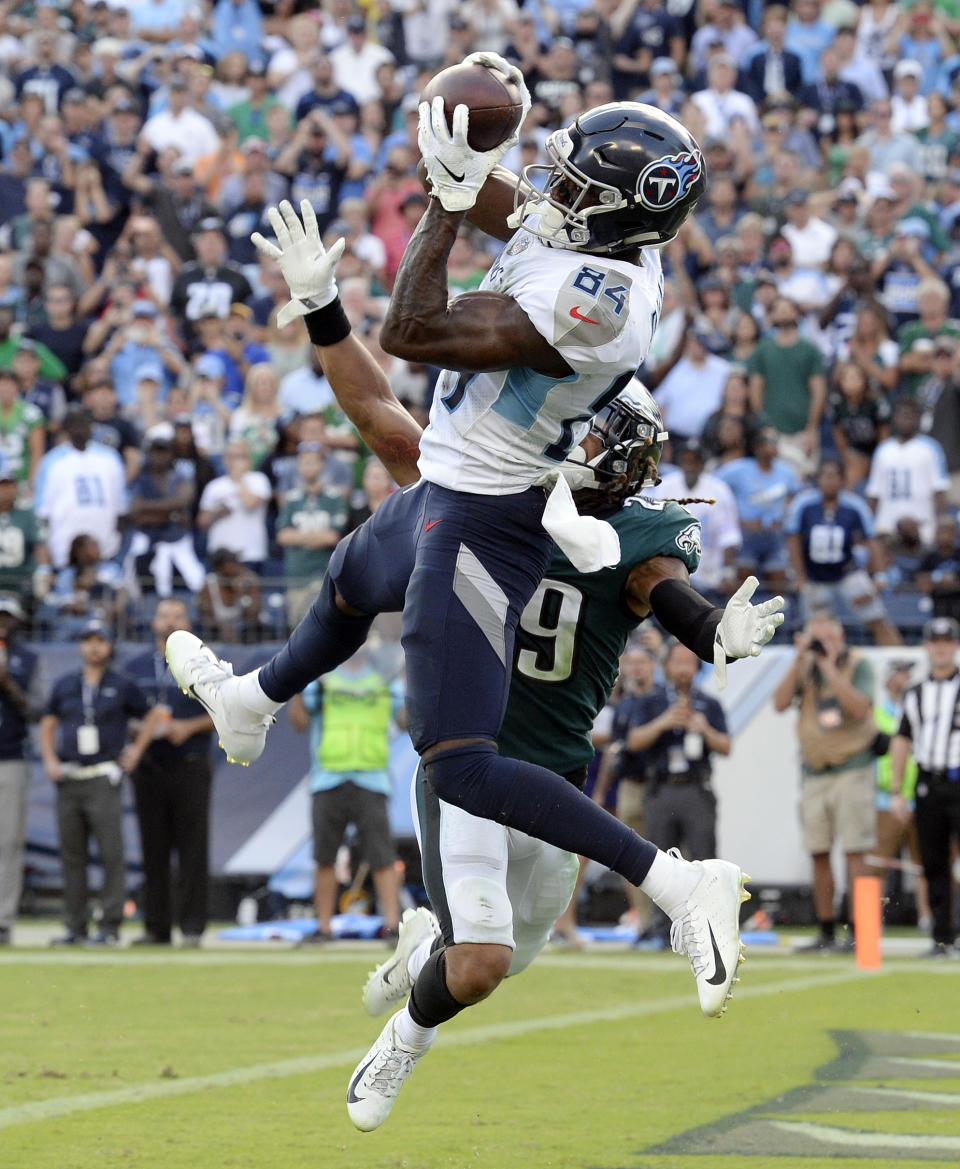 Tennessee Titans wide receiver Corey Davis (84) catches the winning touchdown pass over Philadelphia Eagles cornerback Avonte Maddox (29) in overtime of an NFL football game Sunday, Sept. 30, 2018, in Nashville, Tenn. The Titans won 26-23. (AP Photo/Mark Zaleski)