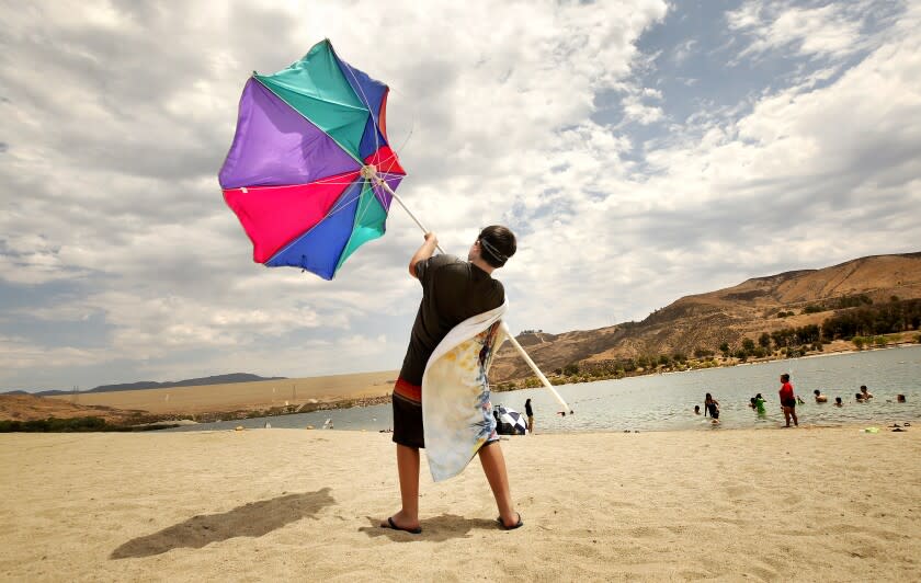 CASTAIC, CA - JULY 08: Zachary Pruett, 10, catches wind with this umbrella