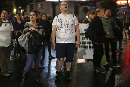 Protesters march against the New York City grand jury decision to not indict in the death of Eric Garner, in Oakland, California December 3, 2014. REUTERS/Stephen Lam