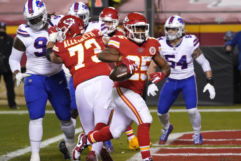 Kansas City Chiefs running back Clyde Edwards-Helaire (25) scores on a 1-yard touchdown run during the first half of the AFC championship NFL football game against the Buffalo Bills, Sunday, Jan. 24, 2021, in Kansas City, Mo. (AP Photo/Orlin Wagner)