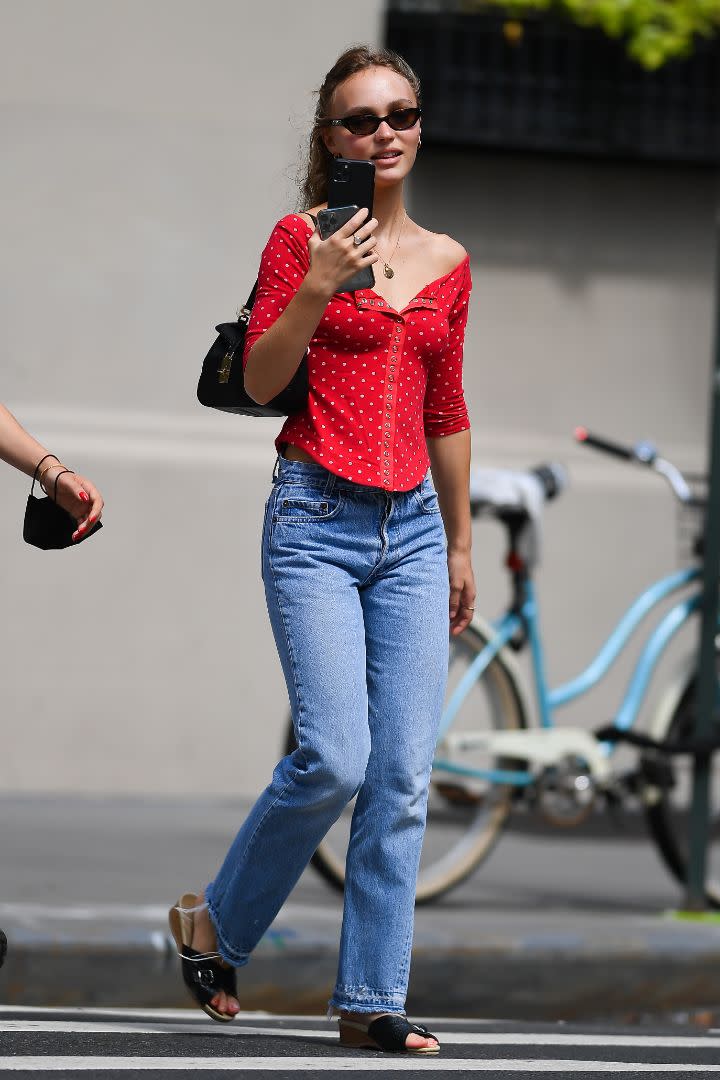 Lily-Rose Depp grabs coffee with a friend in New York, Aug. 17. - Credit: Robert O'Neil/Splash News