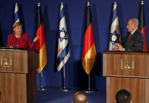 Israeli Prime Minister Benjamin Netanyahu and German Chancellor Angela Merkel give a joint press conference at a hotel in Jerusalem, on October 4, 2018