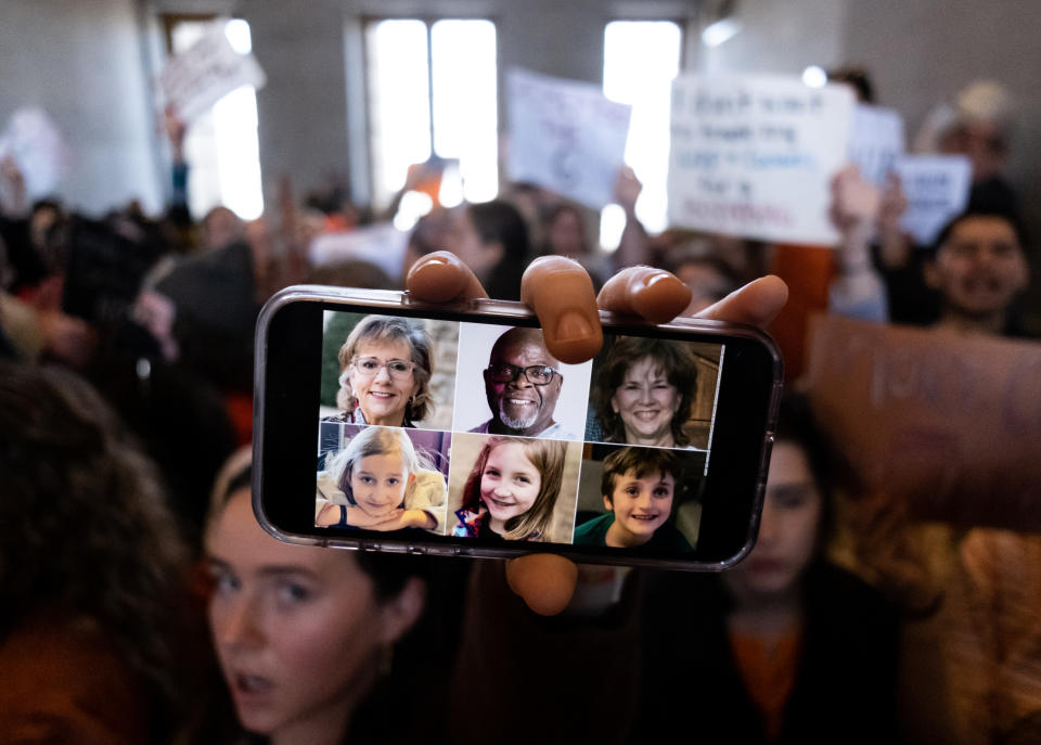 NASHVILLE, TN - MARCH 30: A demonstrator displays a picture of the victims of the Covenant School shooting on their phone inside the Tennessee State Capitol during a protest against gun violence on March 30, 2023 in Nashville, Tennessee.  A 28-year-old former student of the private Covenant School in Nashville, wielding a handgun and two AR-style weapons, shot and killed three 9-year-old students and three adults before being killed by responding police officers on March 27th.  (Photo by Seth Herald/Getty Images)