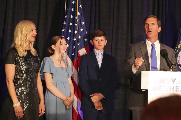 Kentucky Gov. Andy Beshear, right, speaks to supporters accompanied by his son Will, daughter Lila and wife Britainy, after winning the Democrat primary election at the Kentucky Historical Society in Frankfort, Ky., Tuesday, May 16, 2023. (AP Photo/James Crisp)