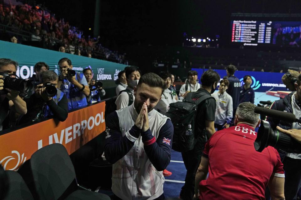 Britain's Giarnni Regini-Moran celebrates after winning the gold medal in the floor finals during the Artistic Gymnastics World Championships at M&S Bank Arena in Liverpool, England, Saturday, Nov. 5, 2022. (AP Photo/Thanassis Stavrakis)