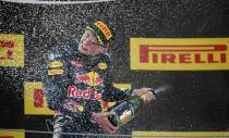 Red Bull F1 driver Max Verstappen of The Netherlands is sprayed with champagne as he celebrates after winning Spanish Grand Prix. Spanish Grand Prix - Barcelona-Catalunya racetrack, Montmelo, Spain - 15/5/16. REUTERS/Juan Medina