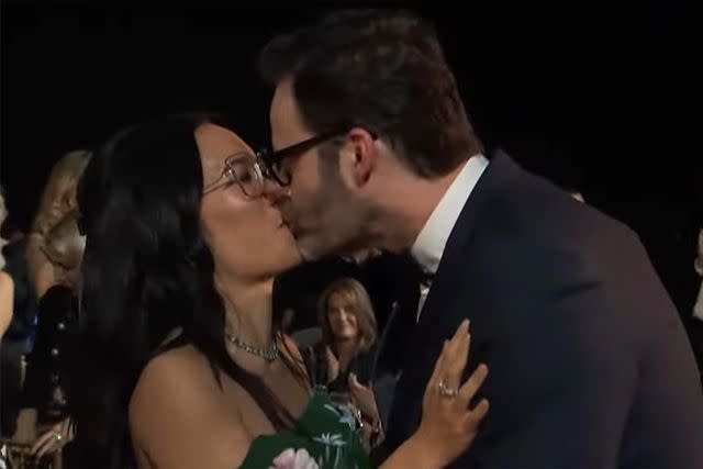<p>The CW</p> Ali Wong and Bill Hader share a kiss following her win at the 2024 Critics Choice Awards