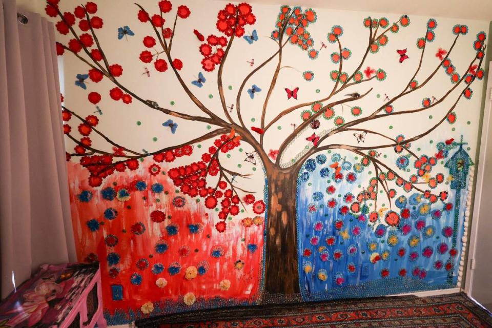 A tree mural is accented with mosaic tiles in a bedroom in the San Luis Obispo home owned by Bruce and Suki Mason, seen here on May 10, 2024.